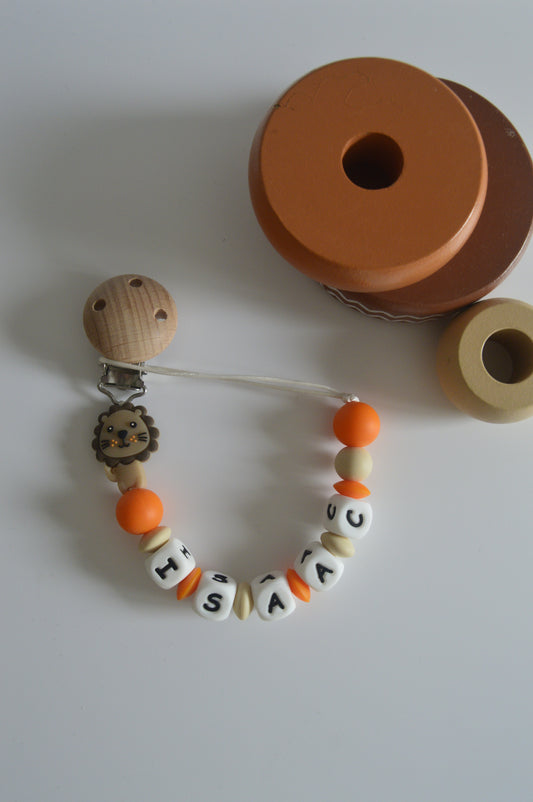 Prendedor de chupeta leão